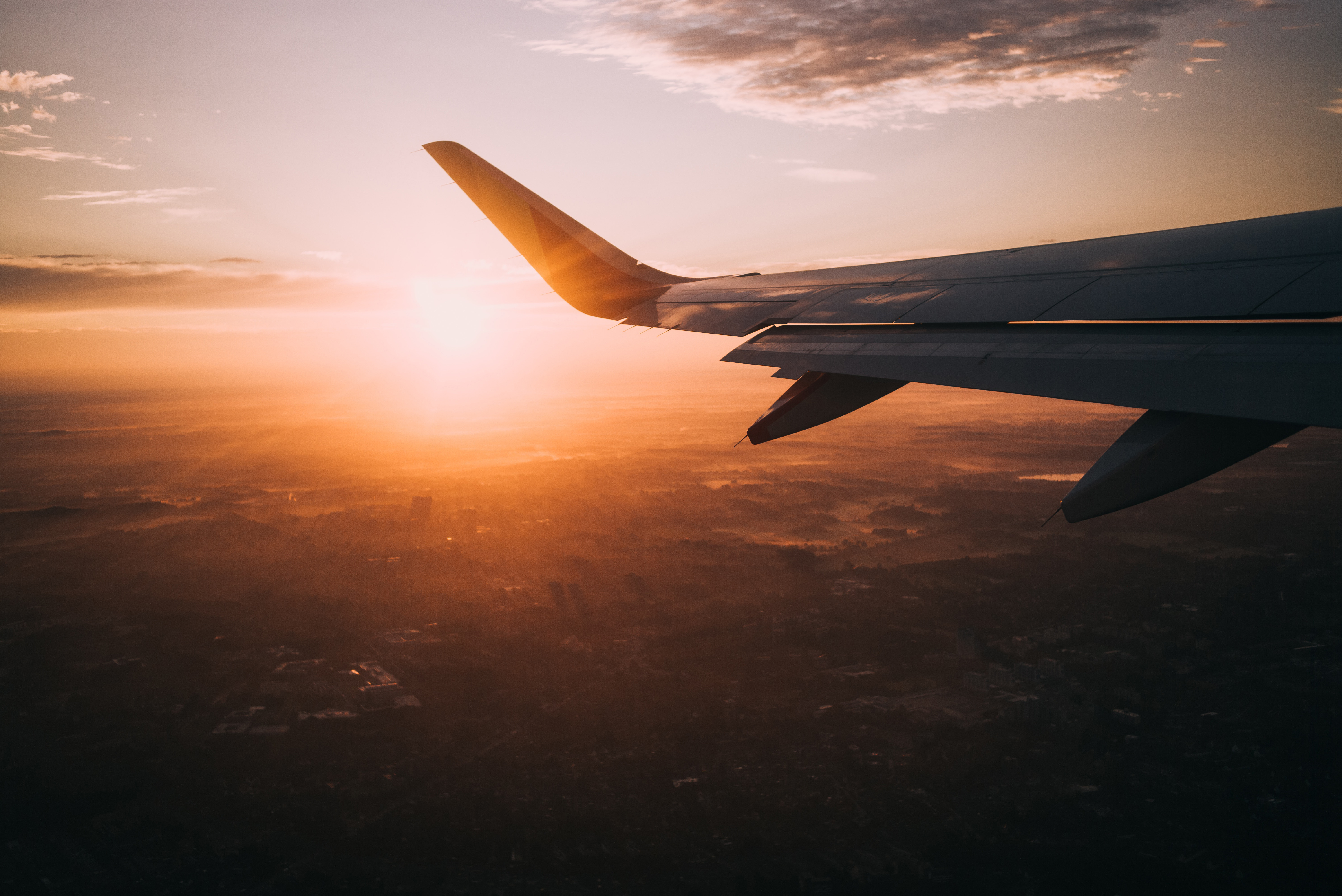 A horizontal image captured from air plane window for a magical sunset