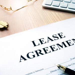 Rental lease agreement form on an office desk.