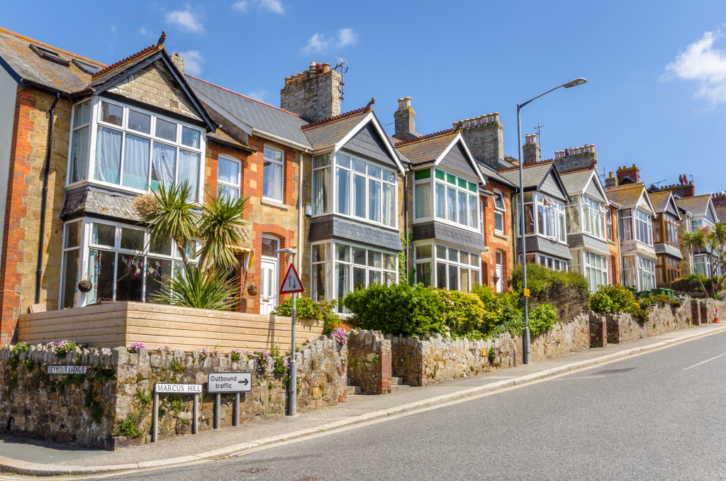 Photograph of a row of British terraced houses on a sunny day