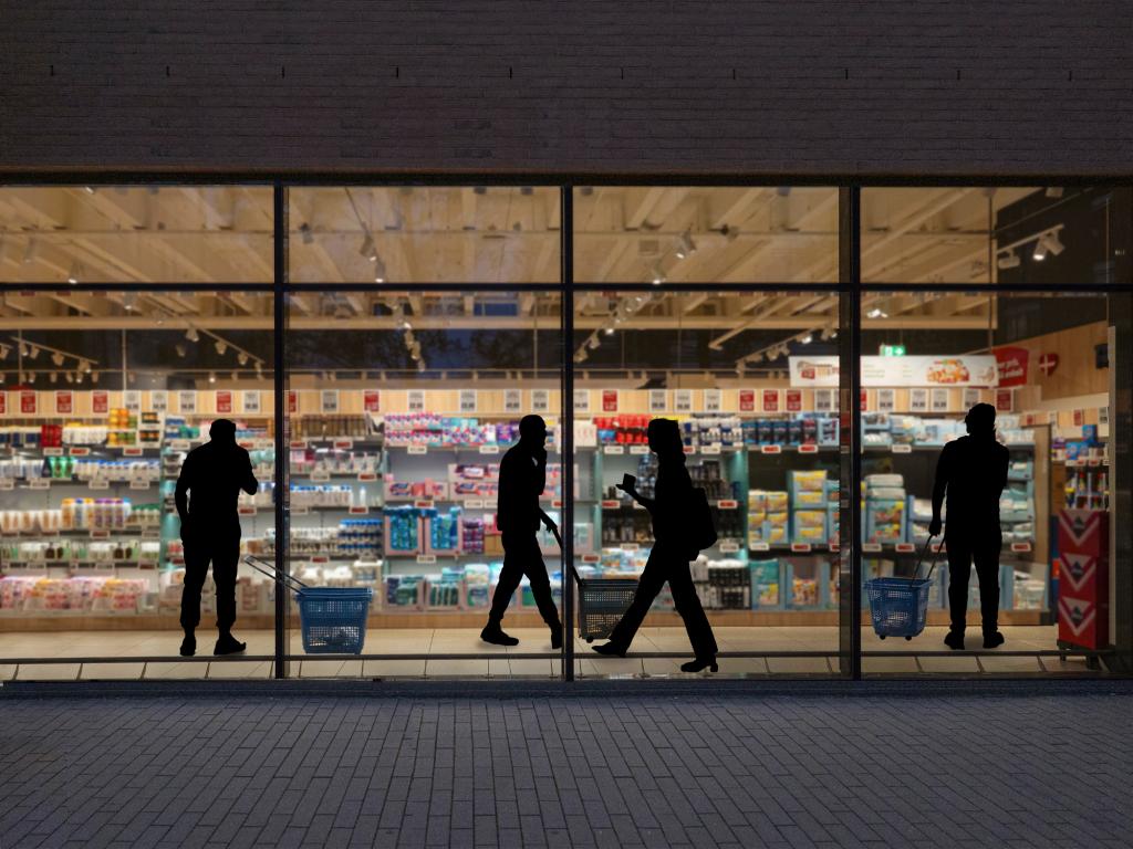 A look through a window in a supermarket at night.