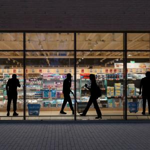 A look through a window in a supermarket at night.